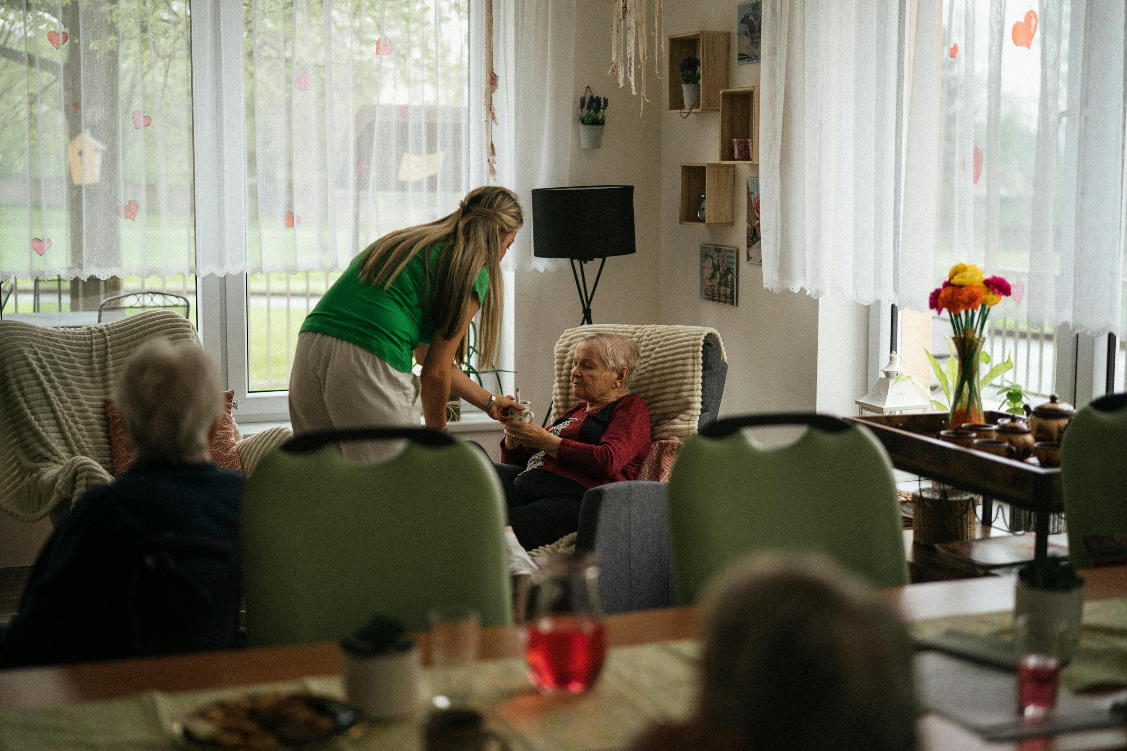 A care coordinator meets with a family at home.